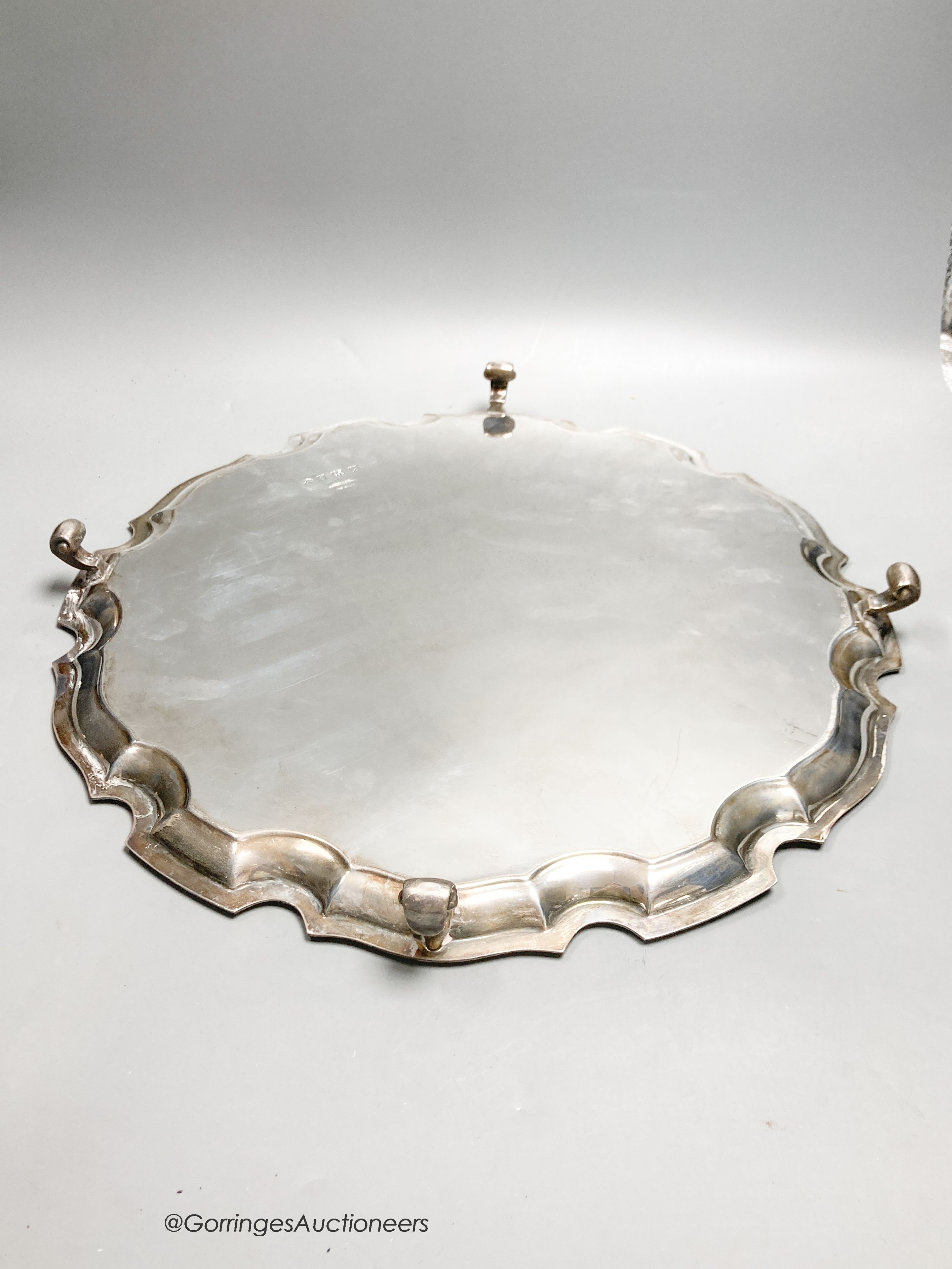 A circular silver salver with Chippendale border, diameter 41cm, Birmingham 1950, 63.5oz.